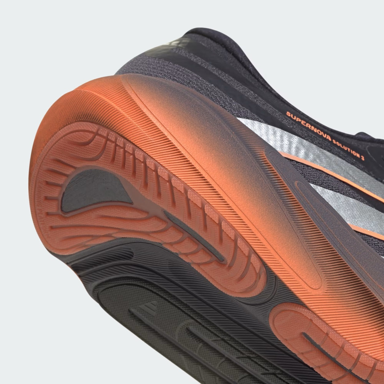 Adidas SUPERNOVA SOLUTION 3-
Aurora Onix / Silver Metallic / Lucid Orange